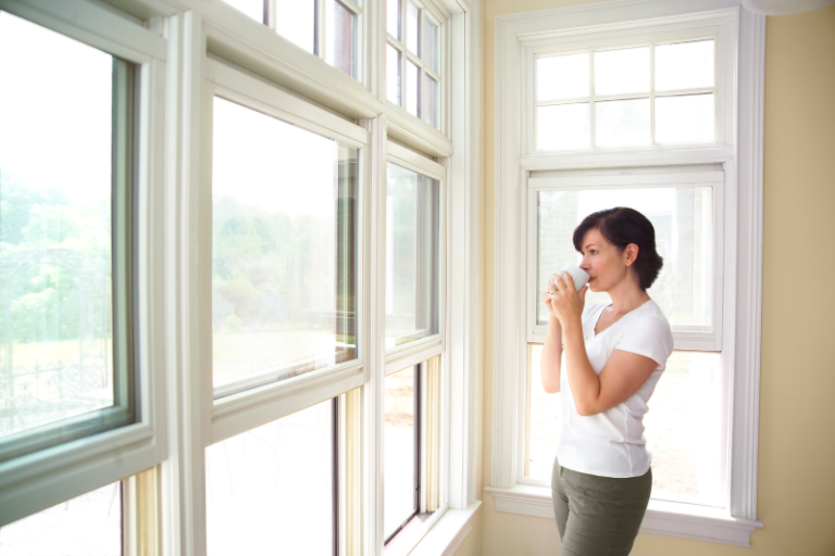 Homeowner Admiring Newly Installed | Rolox Home Service LLC Windows
