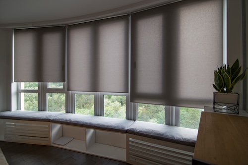 Interior Motorized Roller Shades on Bay Window | Rolox Home Services LLC