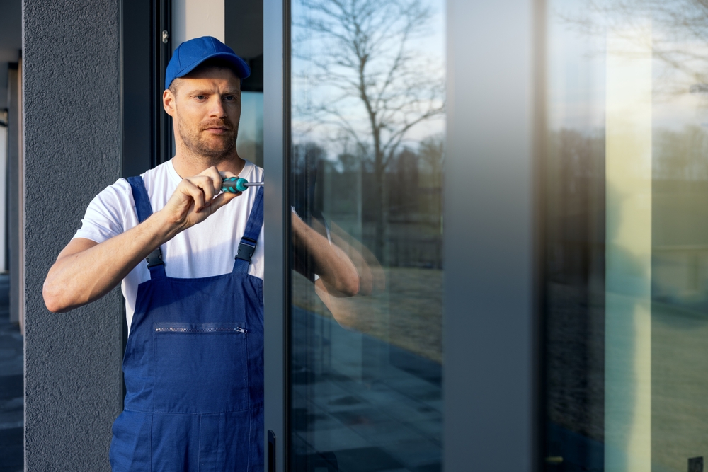 image of a man installing a sliding glass door