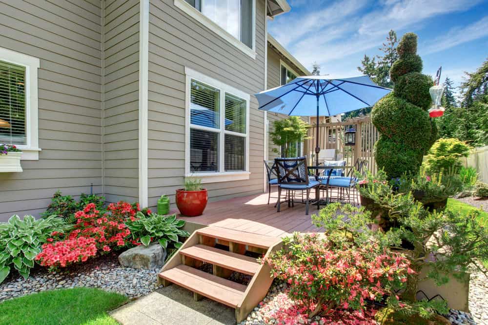 Deck with blue umbrella patio set