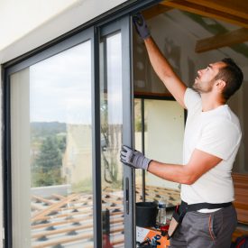 Handsome,Young,Man,Installing,Bay,Window,In,A,New,House